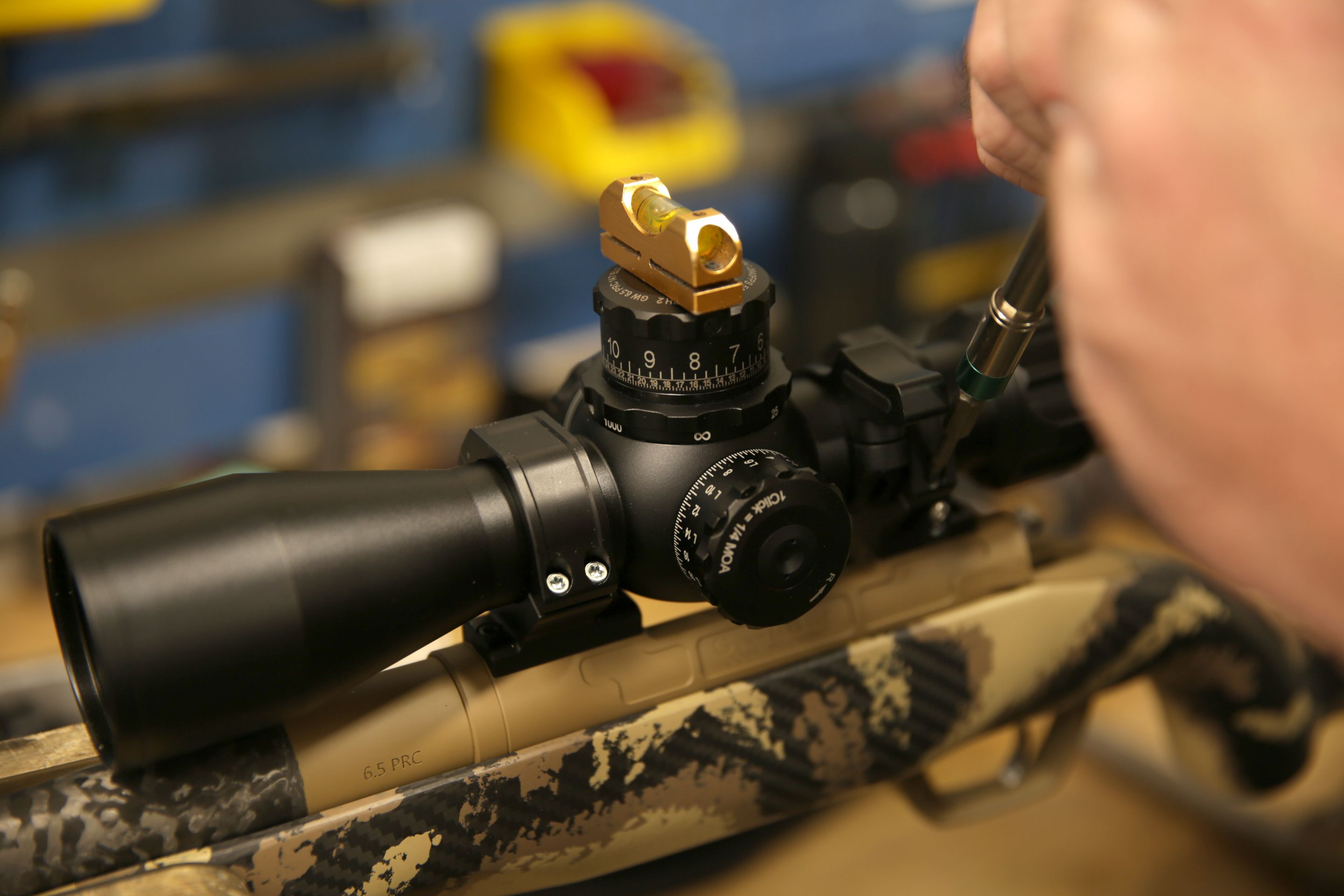 scope on rifle Gunsmith working on rifle scope
